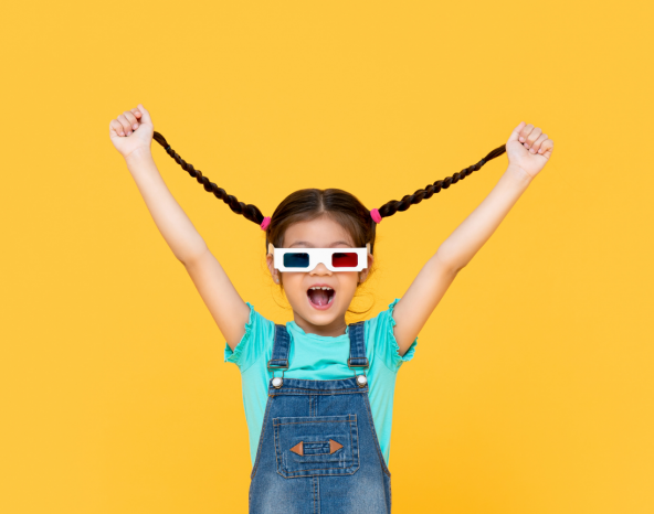 Happy child wearing 3D movie glasses