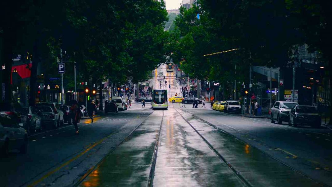 Wet road and tram in Bourke Street Melbourne